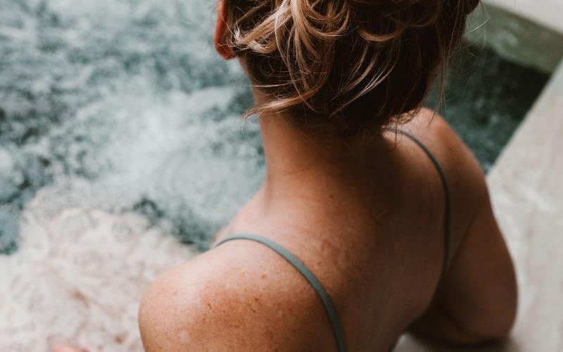 woman sitting in hot tub